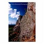 The red rocks and walls of the Zimbabwe Ruins contrasted against a deep blue sky.