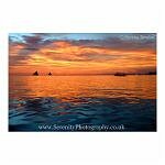 Dazzling orange sunset viewed from the water. Boracay, the Philippines.