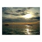 Dazzling orange sunset viewed from the water. Boracay, the Philippines.